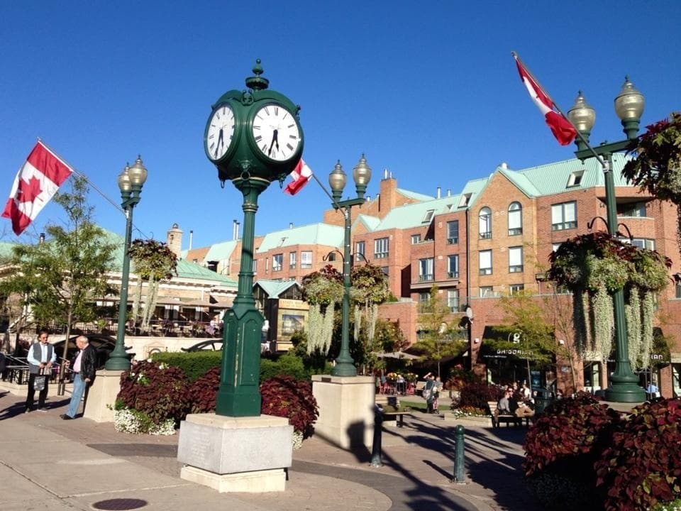 Row of storefronts with street-level entry doors.