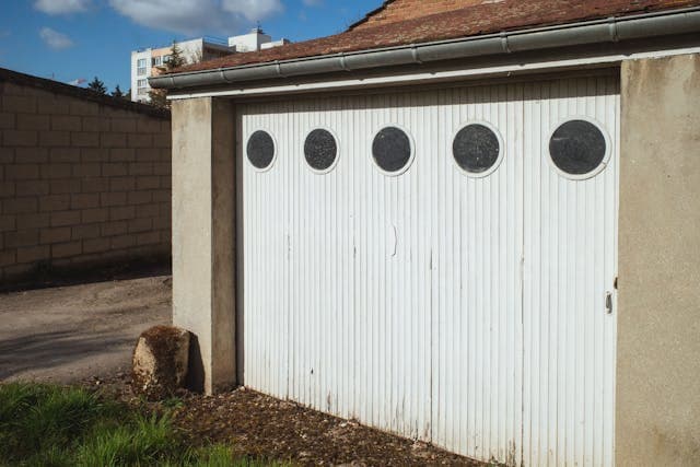 Close-up of a garage door cable being replaced.