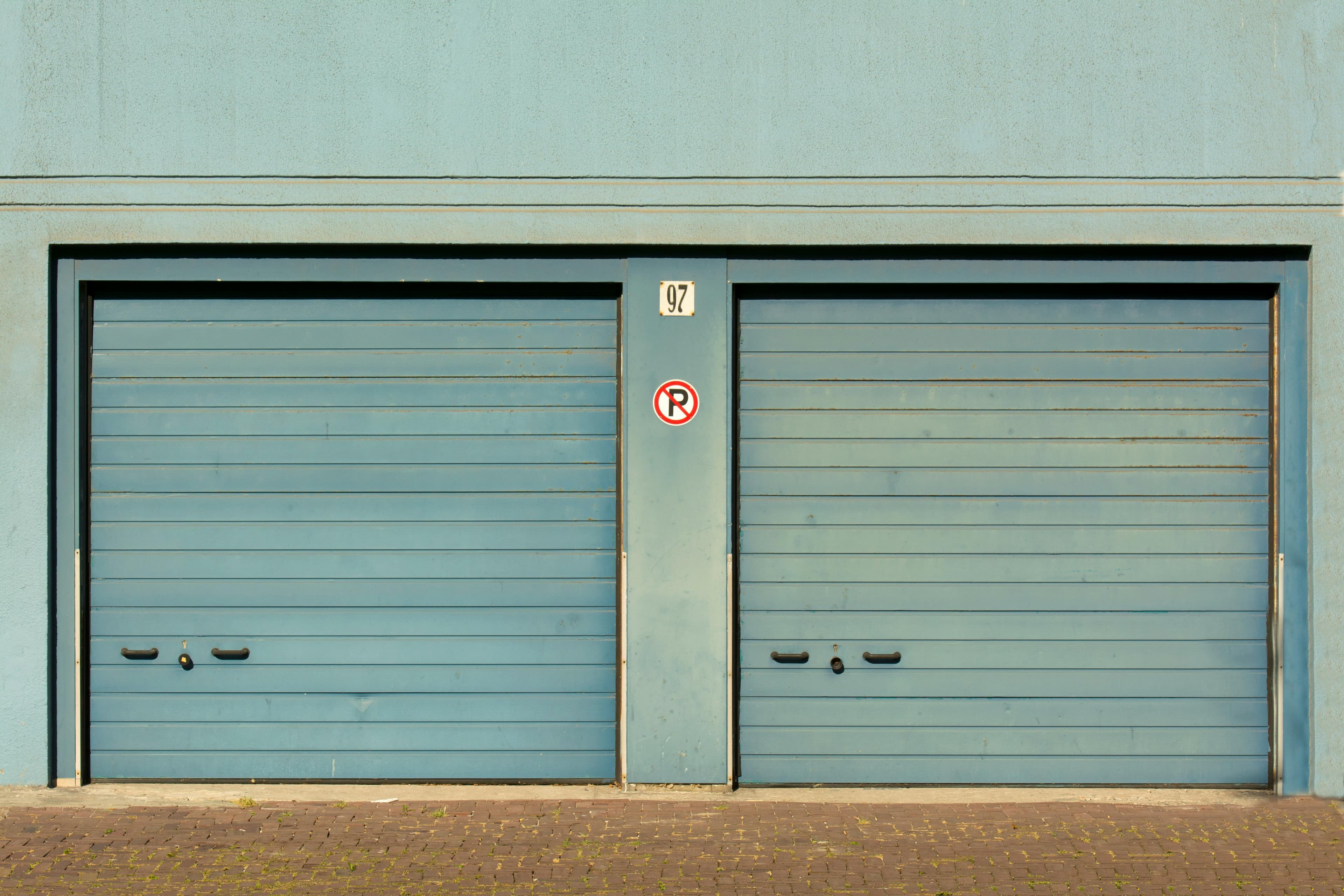 Garage door opener hardware mounted above a door.